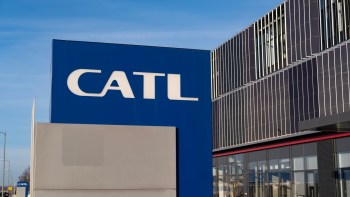 A close-up of a blue sign displaying the CATL logo on a modern building.