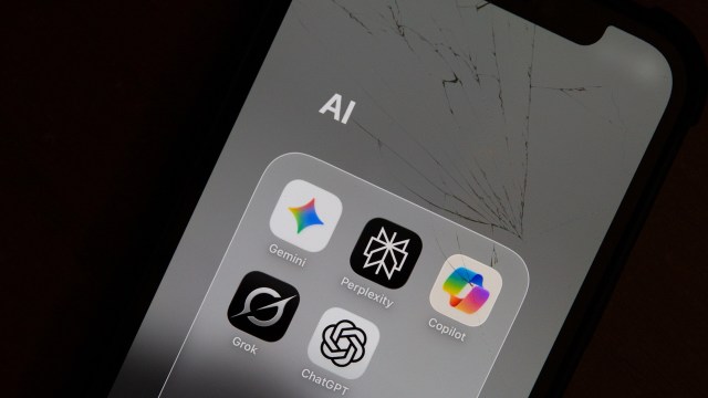 A smartphone screen displaying various AI application icons, including ChatGPT, with a noticeable crack on the surface.