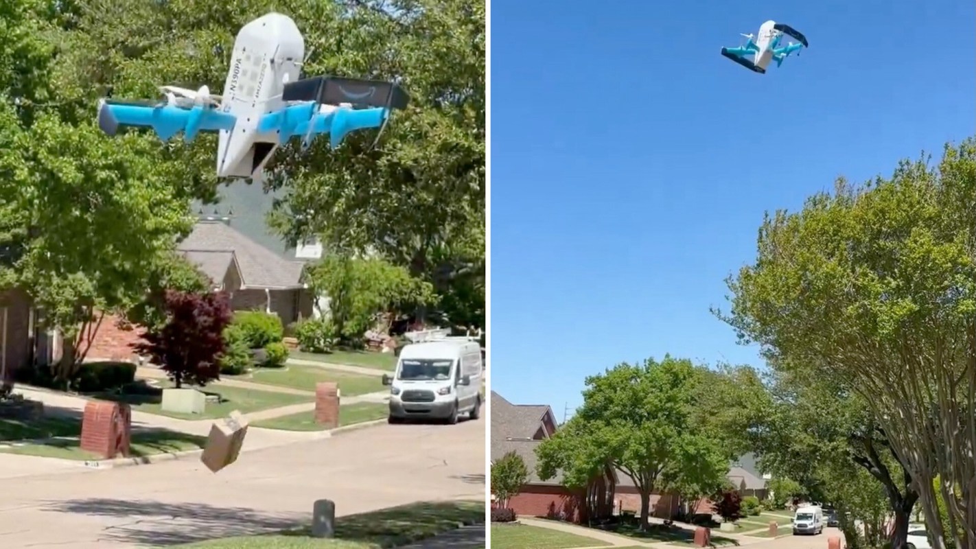 A drone delivers a package over a suburban street lined with trees and houses.