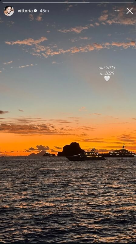 More yachts in the water as the sun sets.