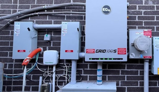 A wall-mounted backup battery system.