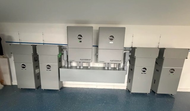 Batteries lining a wall.