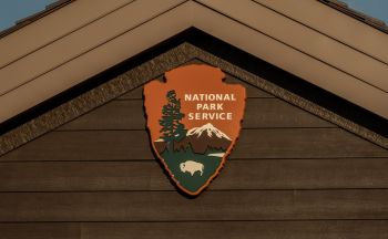 National Park Service sign on building.