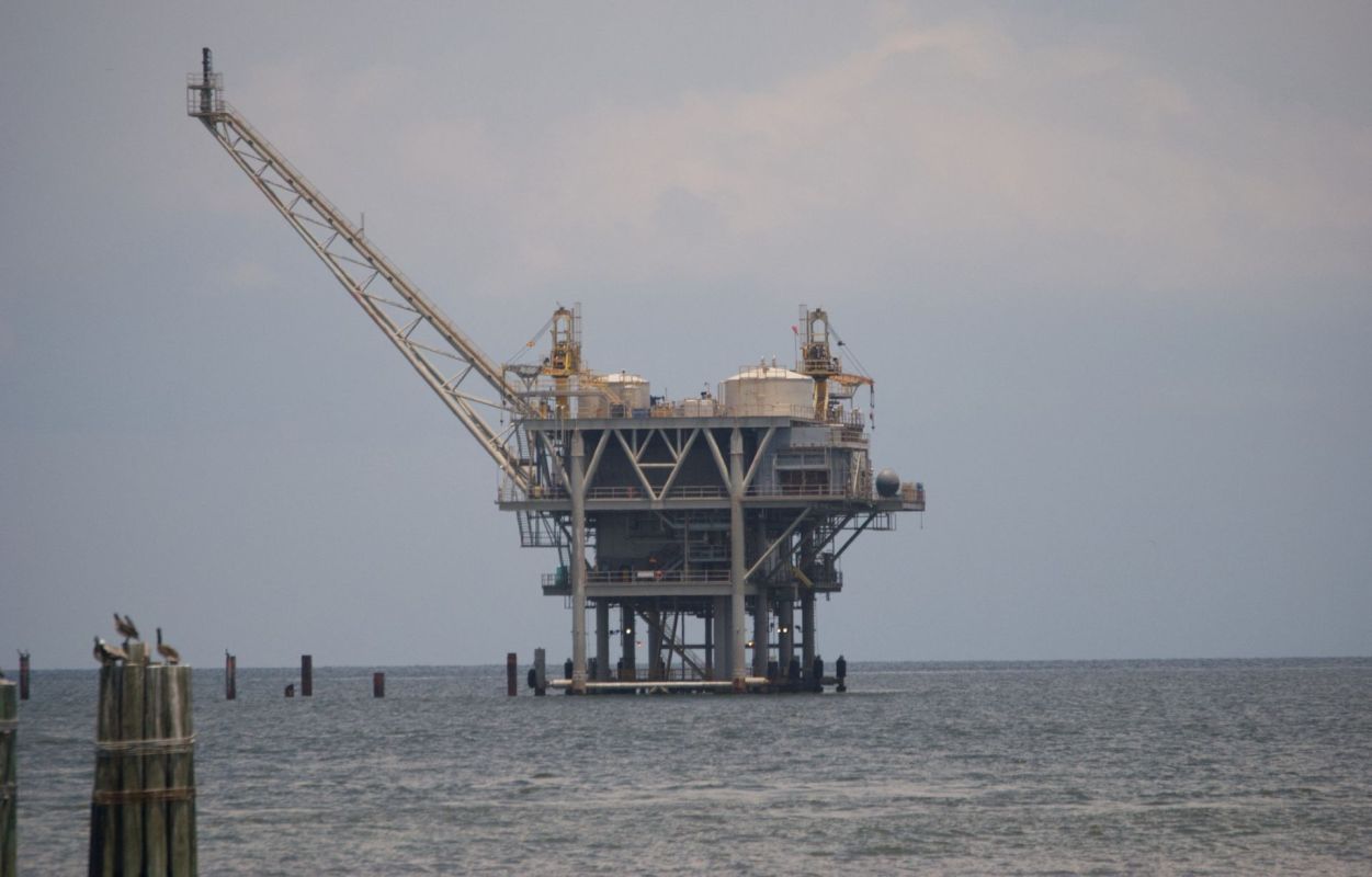 An oil drilling platform on the water.