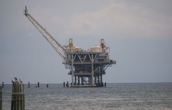 An oil drilling platform on the water.