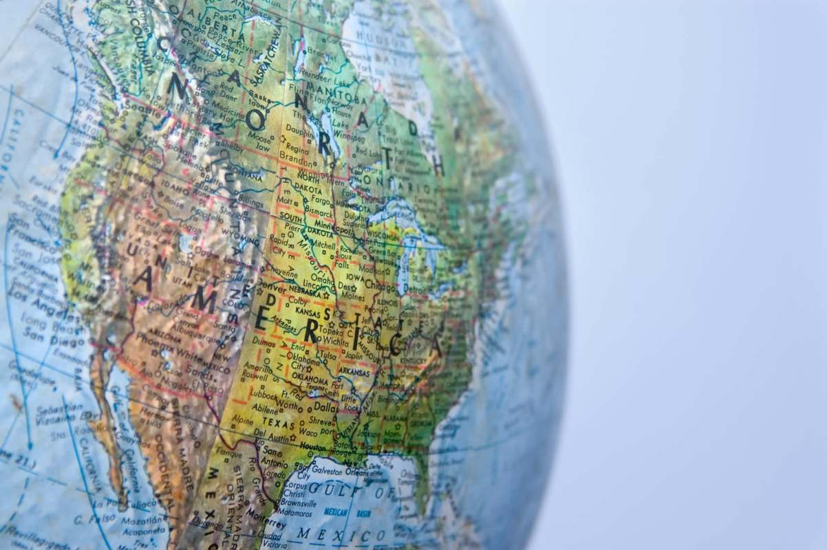 A close-up of a globe highlighting North America with detailed geographical labels.