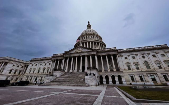 U.S. Capitol building with an overcast sky.