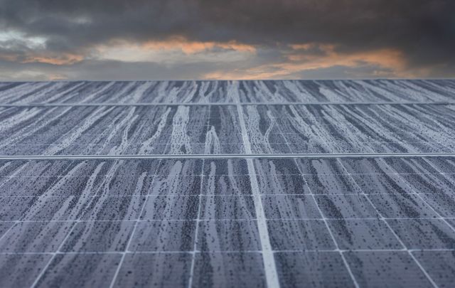 Rain falling on solar panels.