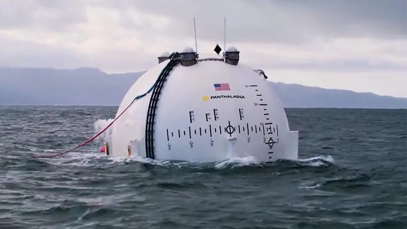 A white, dome-shaped vessel floating in water.