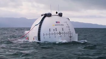 A white, dome-shaped vessel floating in water.
