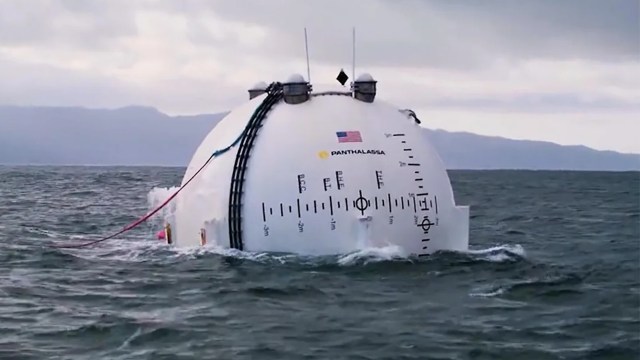 A white, dome-shaped vessel floating in water.