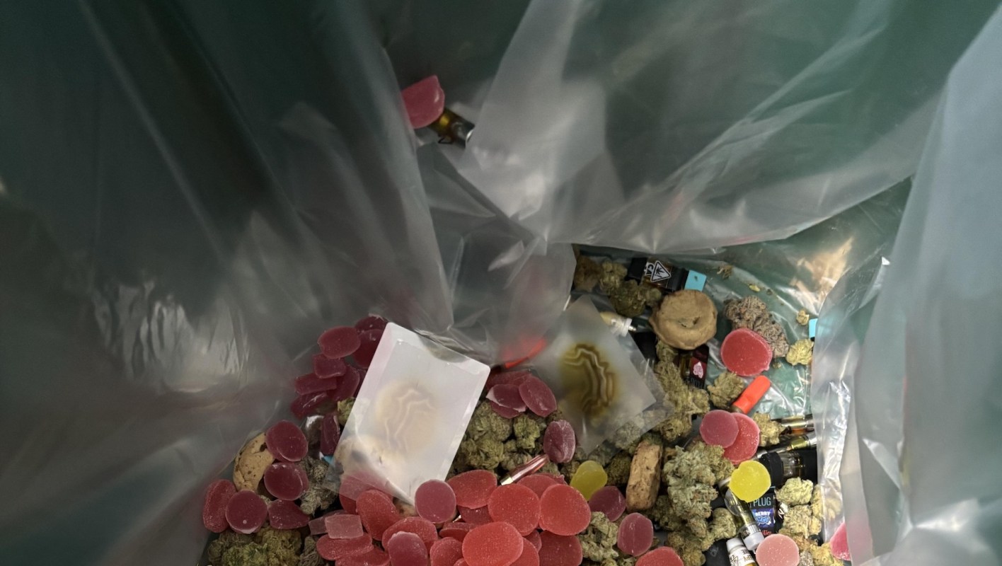A plastic bag of cannabis products, including gummies and other edibles.