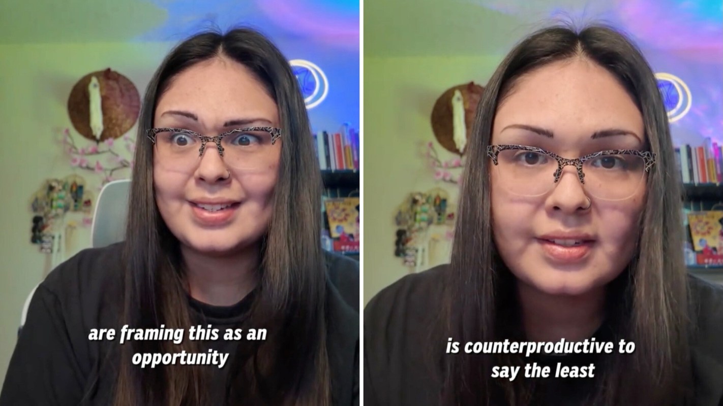 A woman with long brown hair and glasses speaks intently.