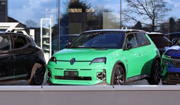 A neon greenish-blue EV at a dealership.