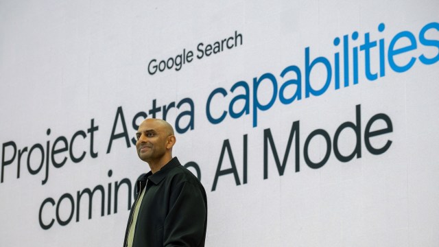 A speaker stands in front of a large screen displaying "Google Search" and "Project Astra capabilities coming to AI Mode."