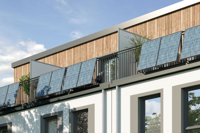 A modern building with balconies with solar panels, wooden accents, and green plants under a bright blue sky.