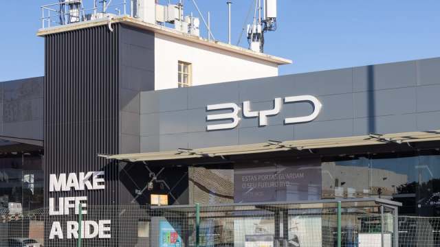 A modern retail building featuring the BYD logo and the phrase "MAKE LIFE A RIDE" prominently displayed.