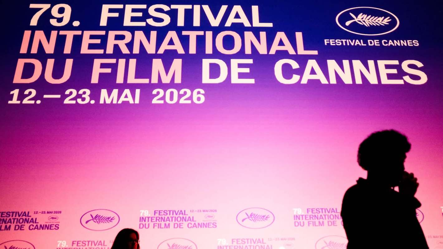 A colorful sign announcing the 79th Cannes Film Festival from May 12 to 23, 2026.