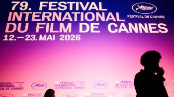 A colorful sign announcing the 79th Cannes Film Festival from May 12 to 23, 2026.