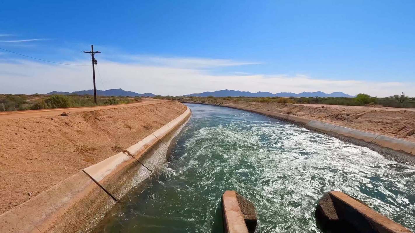 A canal with water from the Colorado River winds through Arizona.