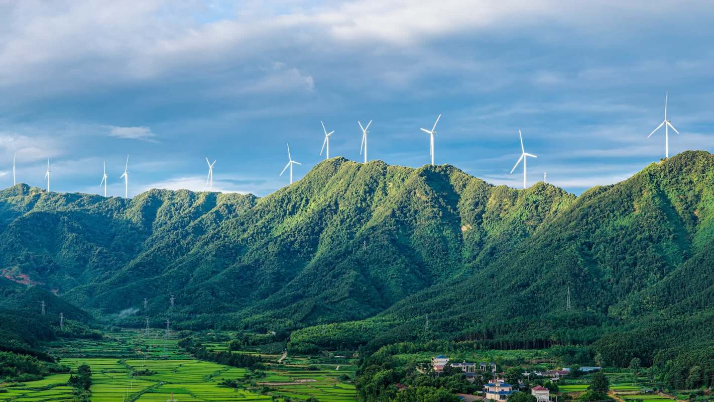 Wind turbines on top of mountains.
