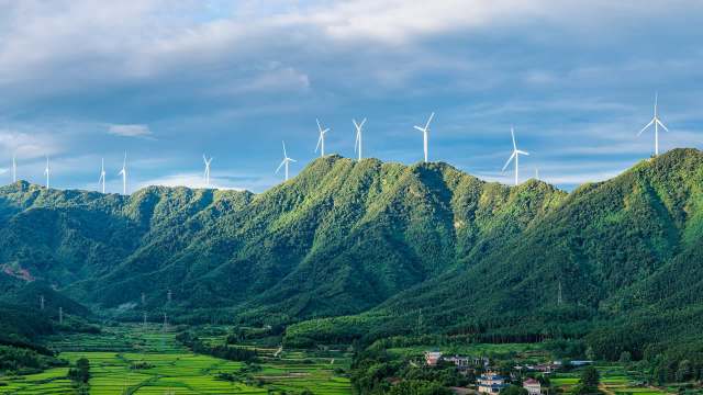 Wind turbines on top of mountains.