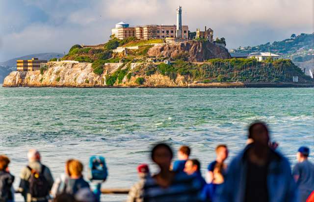 Alcatraz Island with tourists in the foreground.