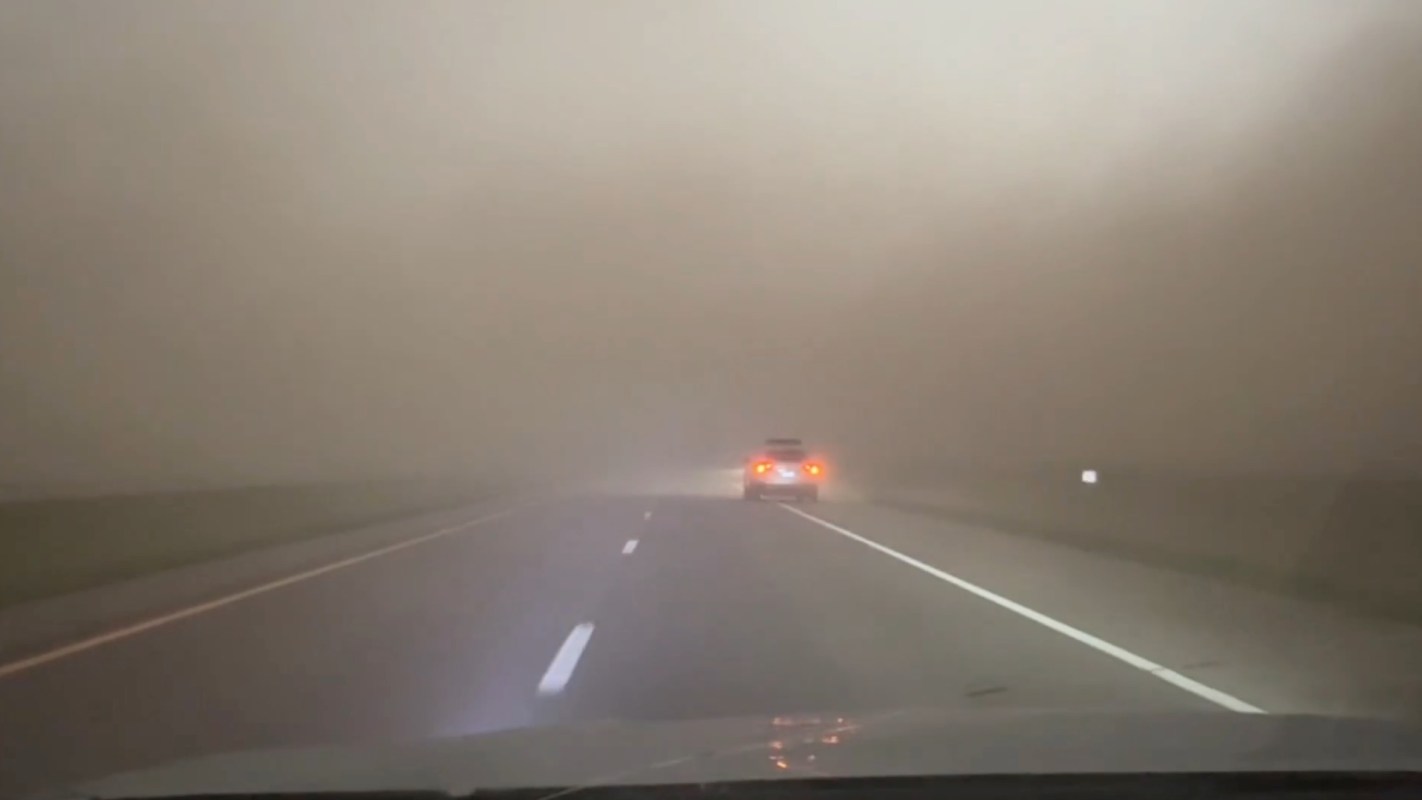 A highway during a dust storm, with limited visibility.