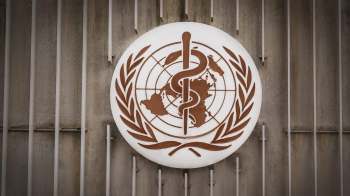 The World Health Organization logo featuring a caduceus and globe, surrounded by an olive wreath.