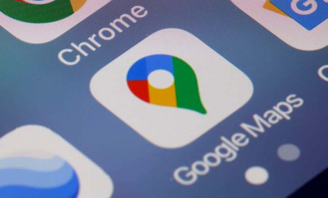 A close-up of a smartphone screen displaying the Google Maps app icon beside the Chrome app icon.
