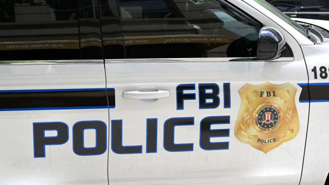 A close-up of an FBI police vehicle featuring the agency's emblem and "FBI police" text on the side.