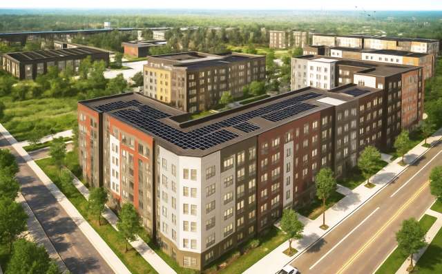 Aerial view of a modern apartment complex featuring solar panels, surrounded by green trees and pathways.