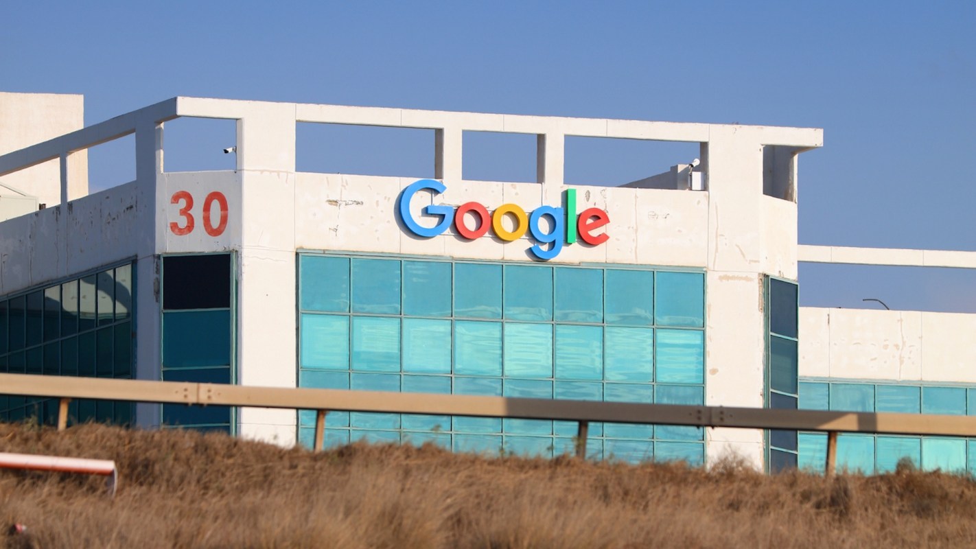 A building with the Google logo above reflective windows.