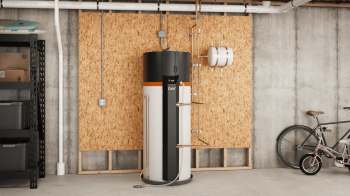 A modern water heater installed against an OSB wall in a garage, with a bicycle nearby.
