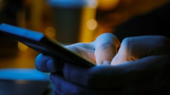 A person texting.