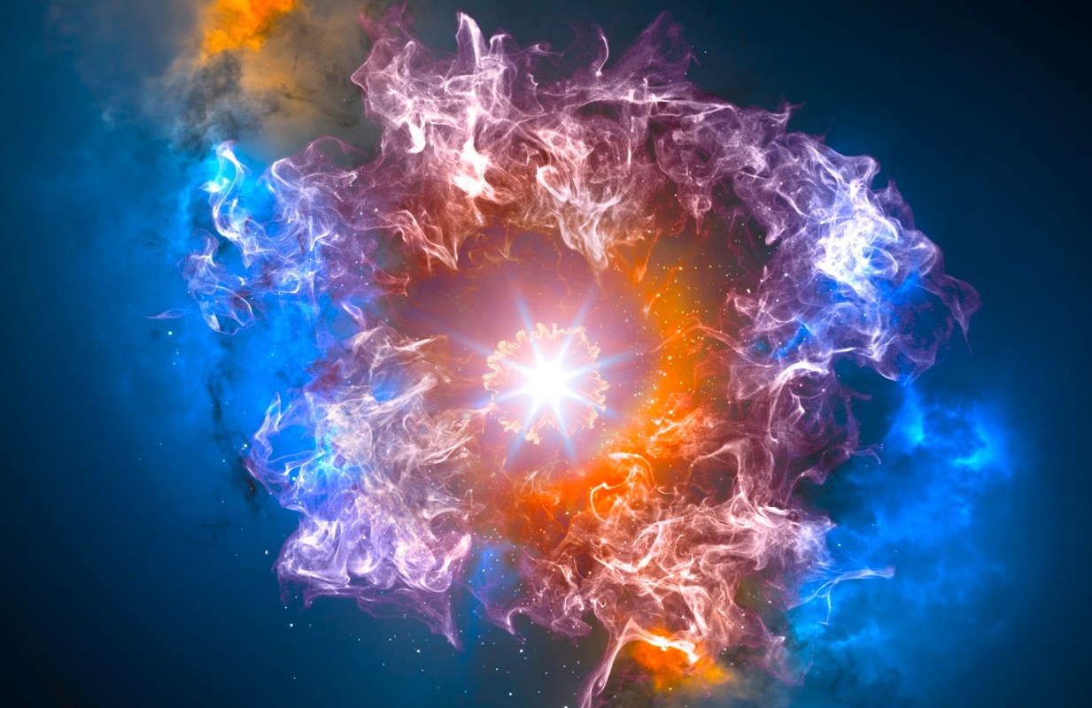 A colorful cosmic explosion surrounded by swirling clouds of gas and light against a dark backdrop.