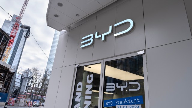 A close-up of the BYD storefront with a modern design and a sign indicating the opening date in Frankfurt, Germany.