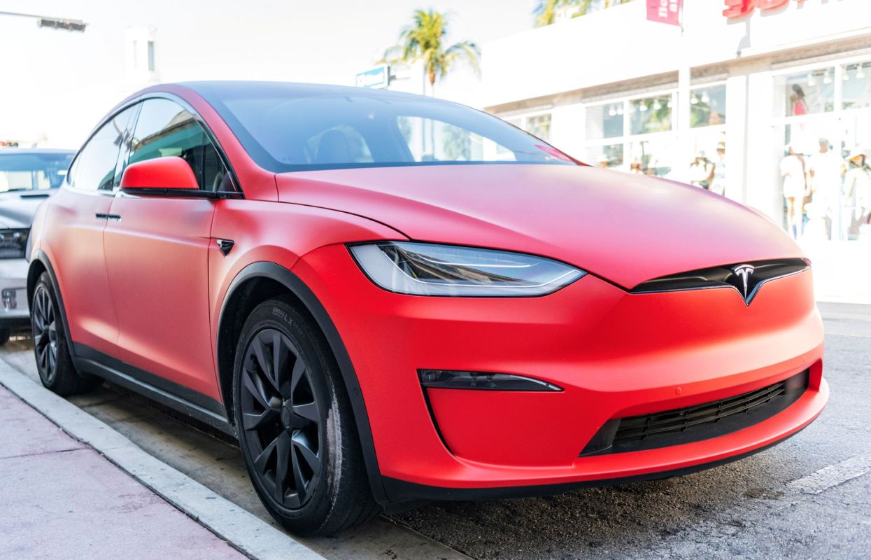 A red matte Tesla Model X.