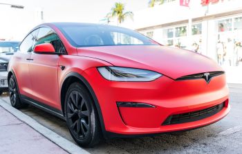A red matte Tesla Model X.