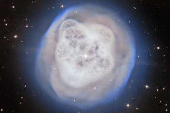 A vibrant nebula surrounded by stars, emitting glowing clouds of gas and dust in the vastness of space.