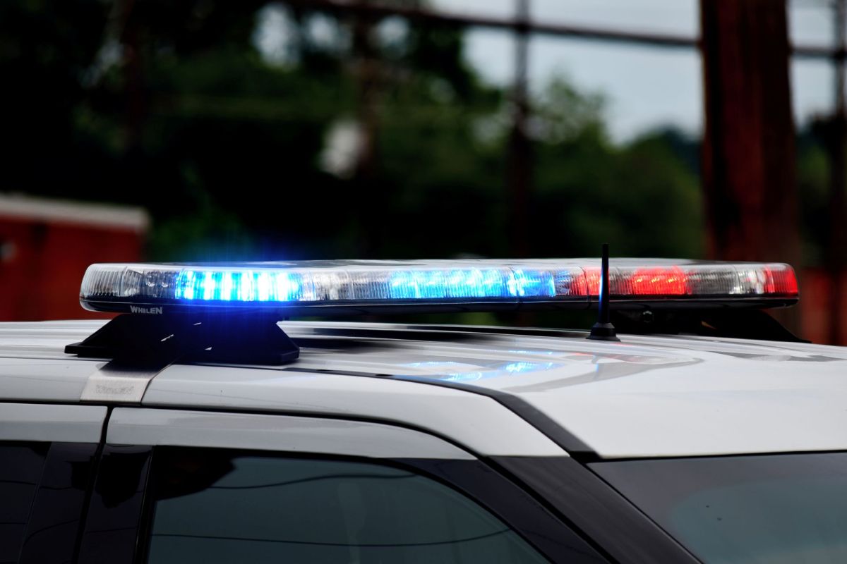 Blue and red lights on top of a police car.