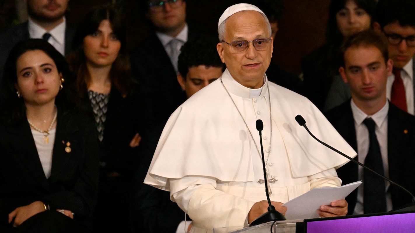 Pope Leo XIV speaks at a podium.