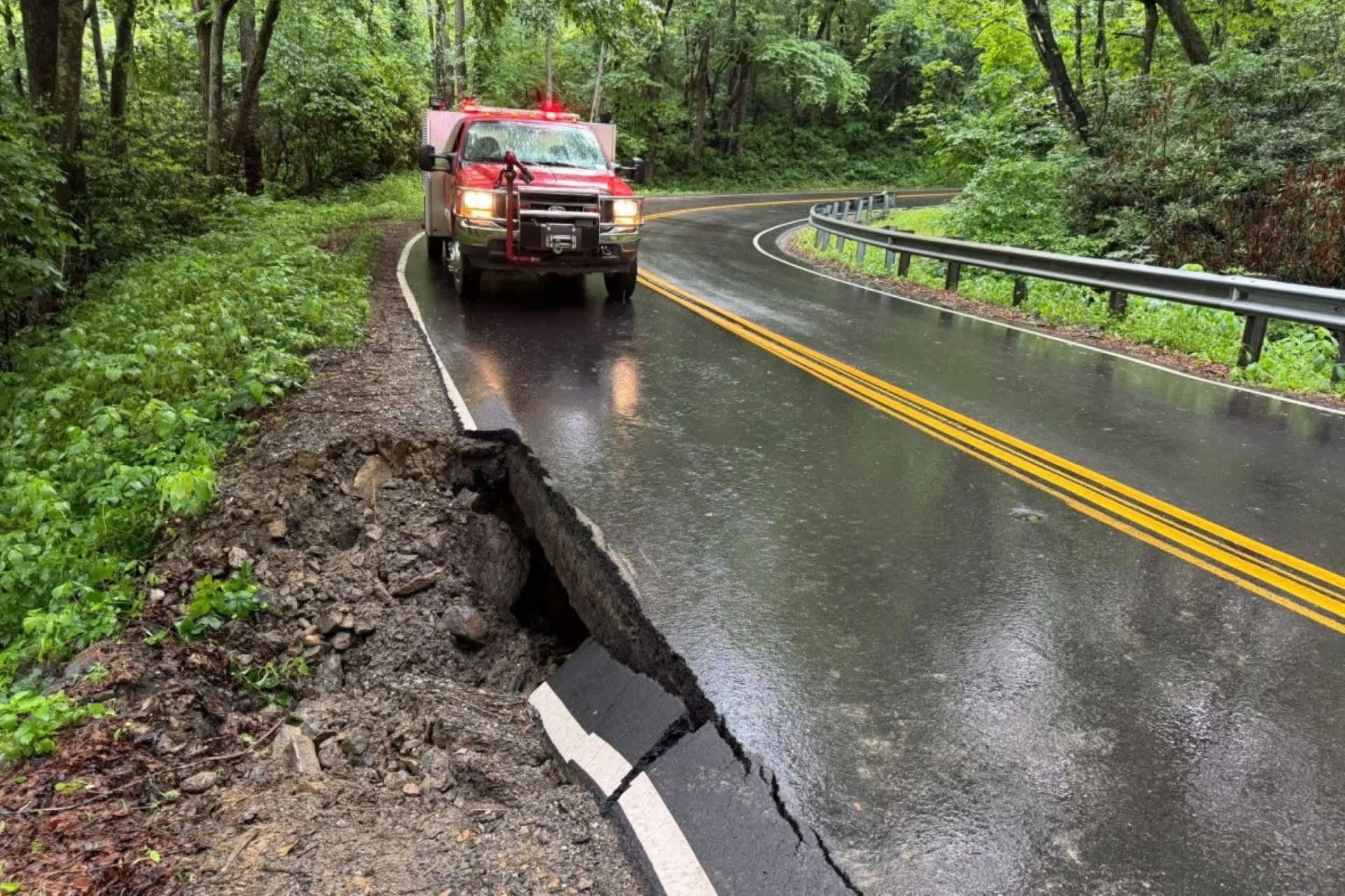 Torrential rain opens 12-foot hole beneath North Carolina highway as flash floods hit Helene recovery zone