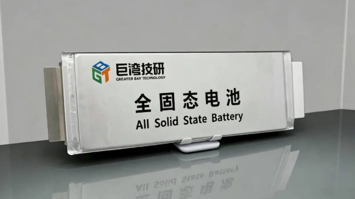 A sleek solid-state battery with "Greater Bay Technology" and "All Solid State Battery" labels prominently displayed.