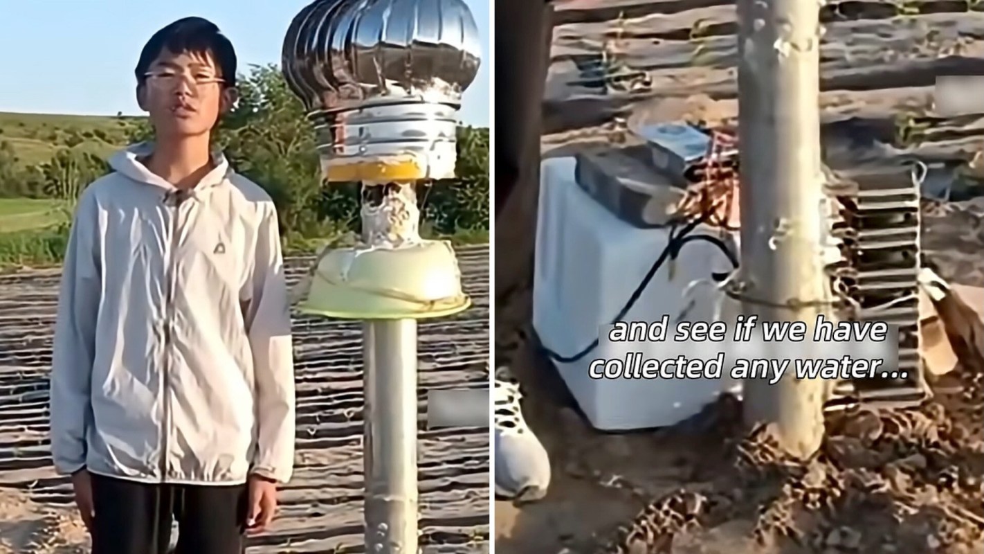 A teenager stands beside a water collection device in a rural field under clear skies.