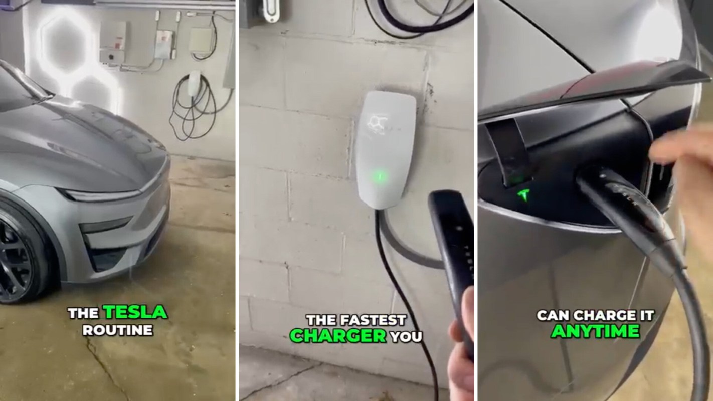A gray Tesla electric vehicle being charged at a wall-mounted charger in a garage.