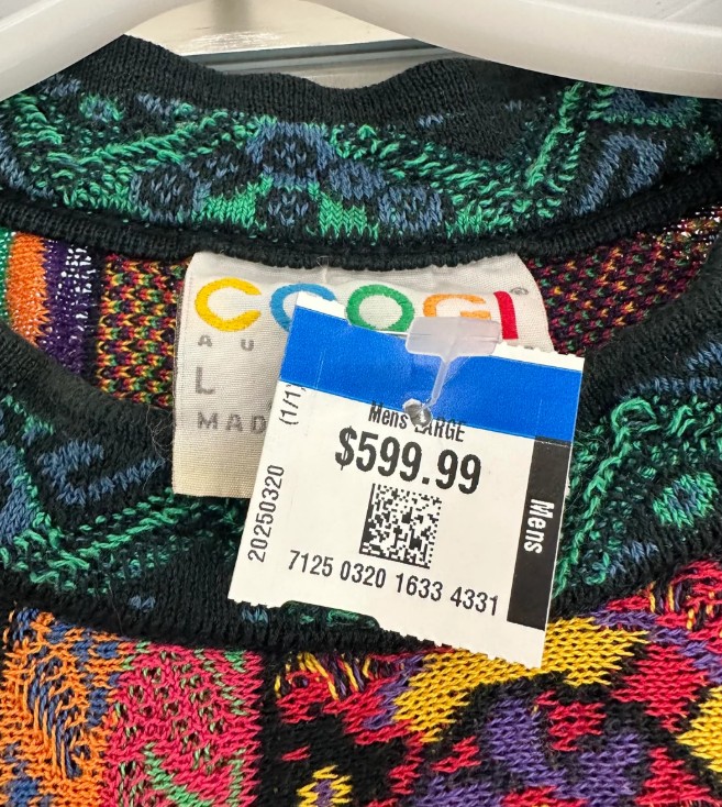 A colorful, patterned sweater with a price tag of $599.99.