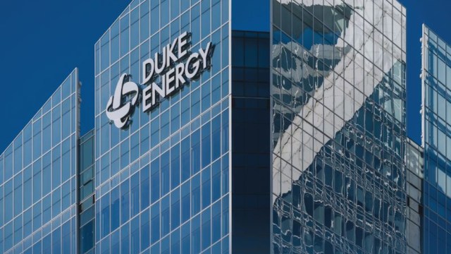 The glass exterior of a building with the Duke Energy logo.