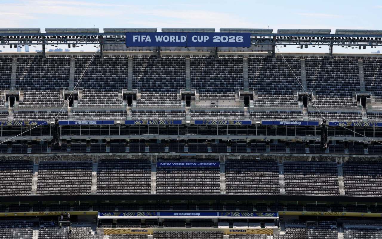 An empty stadium with banners for FIFA World Cup 2026 in New York, New Jersey.