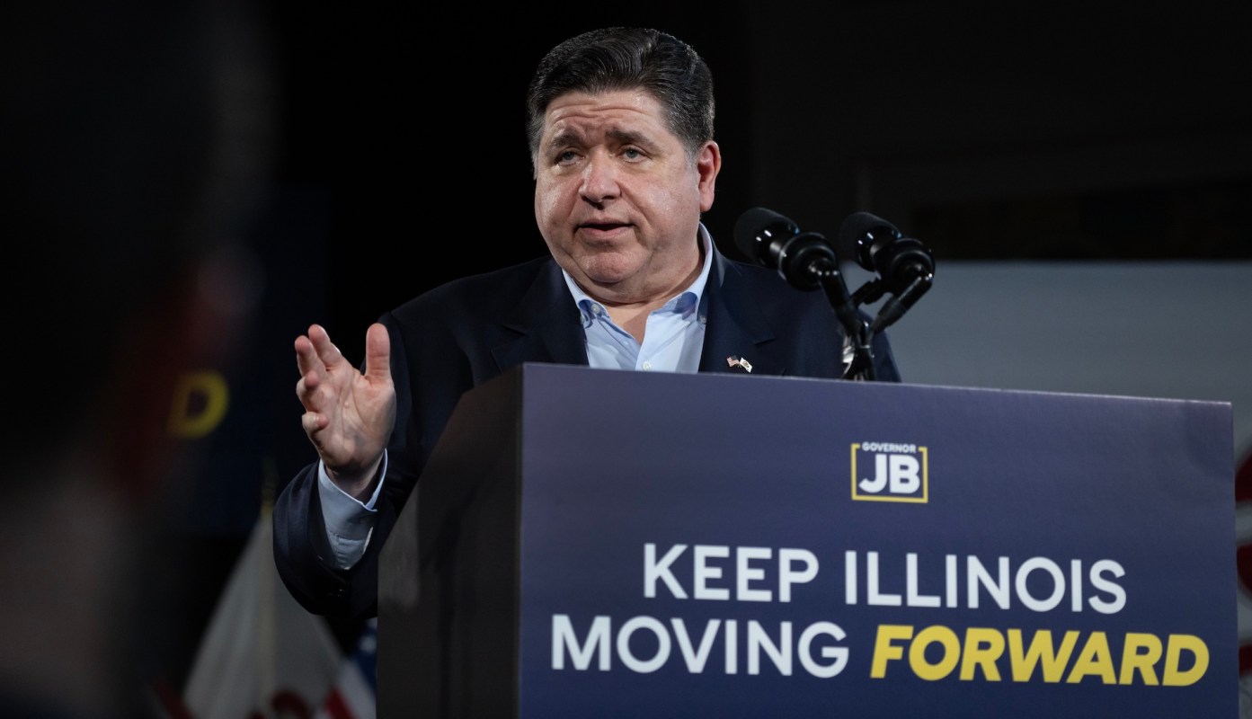 Illinois Gov. JB Pritzker speaks at a podium.